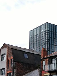 Low angle view of modern building against clear sky