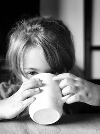 Portrait of child drinking coffee