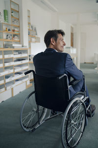 Disabled businessman sitting in wheelchair