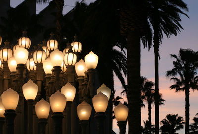 Close-up of illuminated lantern against sky at night