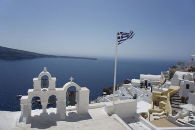 Panoramic view of aegean sea and buildings against clear blue sky