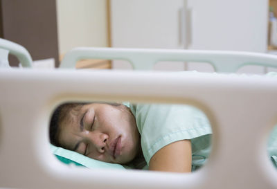 Patient sleeping on bed in hospital
