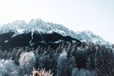 Scenic view of snowcapped mountains against clear sky