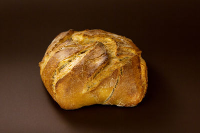 Close-up of bread against black background