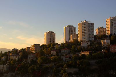 Cityscape against sky during sunset