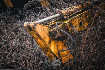 Old rusty car on field