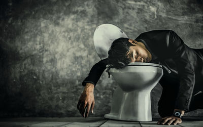 Rear view of man standing by food