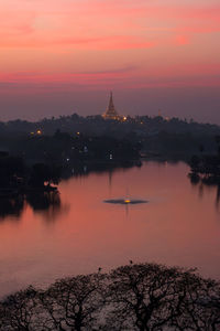 Reflection of church in water at sunset