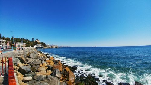 Scenic view of sea against clear blue sky