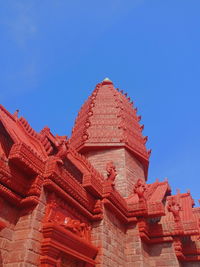 Low angle view of temple against clear blue sky