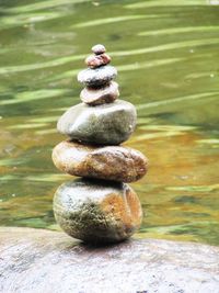 Close-up of stone stack on rock