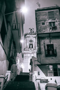 Low angle view of illuminated street light at night