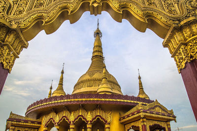 Low angle view of gold colored buddhist temple