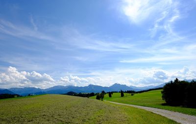 Scenic view of mountains against cloudy sky