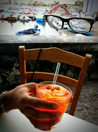 Close-up of hand holding drink