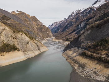 Panoramic drone shot of low water on lac chambon in french alps