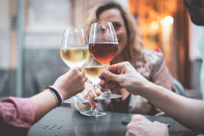 Friends toasting wineglasses in restaurant