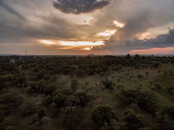 Flying over the sunset of a place called vallemi in paraguay, pure nature minutes away from the city