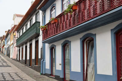 Houses by street in city