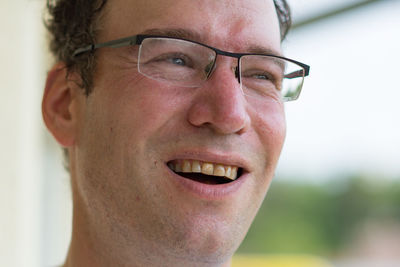 Close-up portrait of a smiling young man