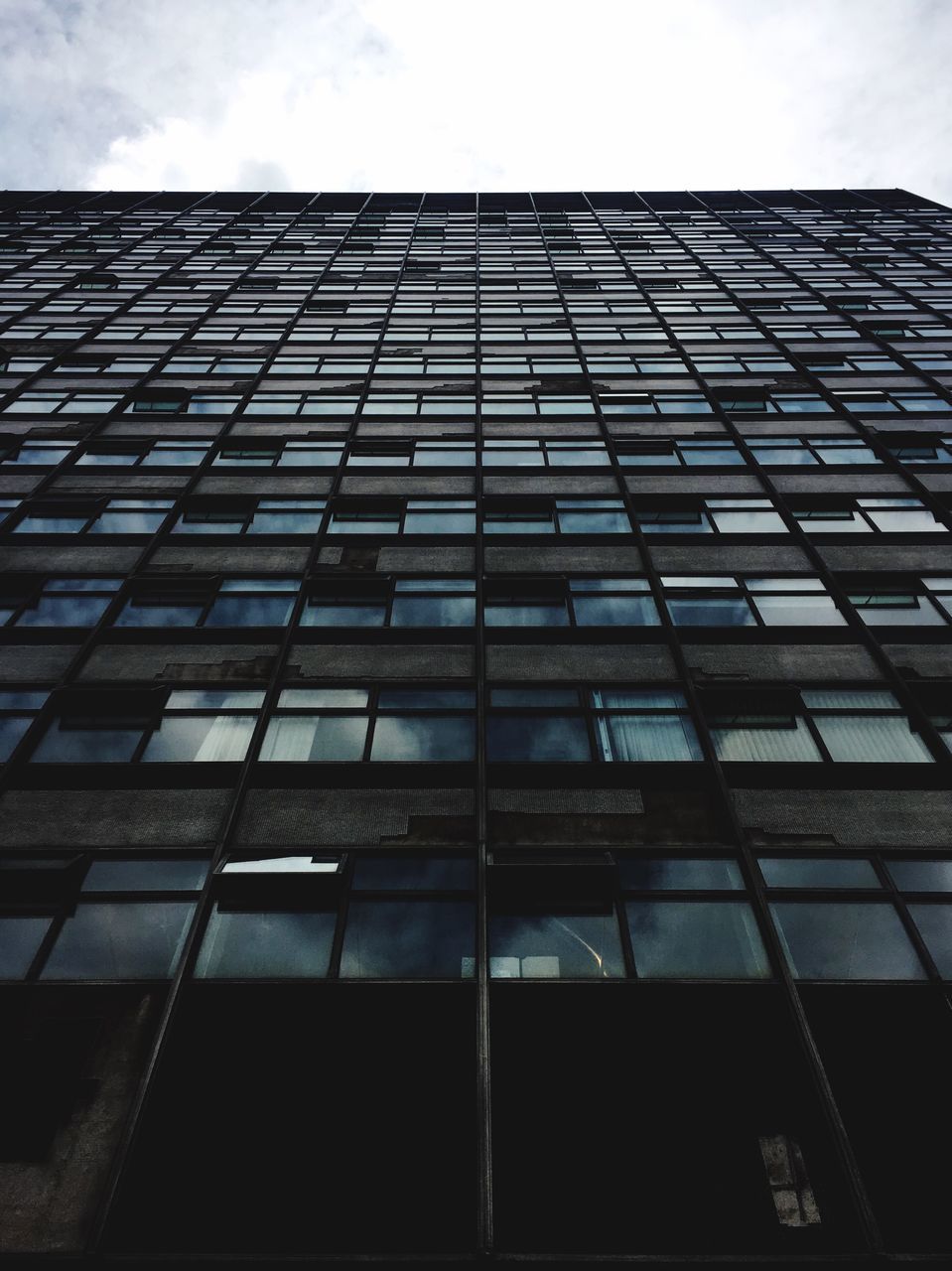 architecture, building exterior, built structure, low angle view, modern, office building, building, sky, city, glass - material, window, tall - high, skyscraper, reflection, tower, day, cloud - sky, outdoors, no people, architectural feature