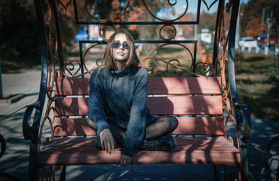 Portrait of woman sitting on seat