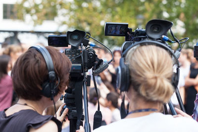 Rear view of female journalist