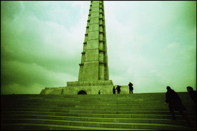 Low angle view of people climbing steps