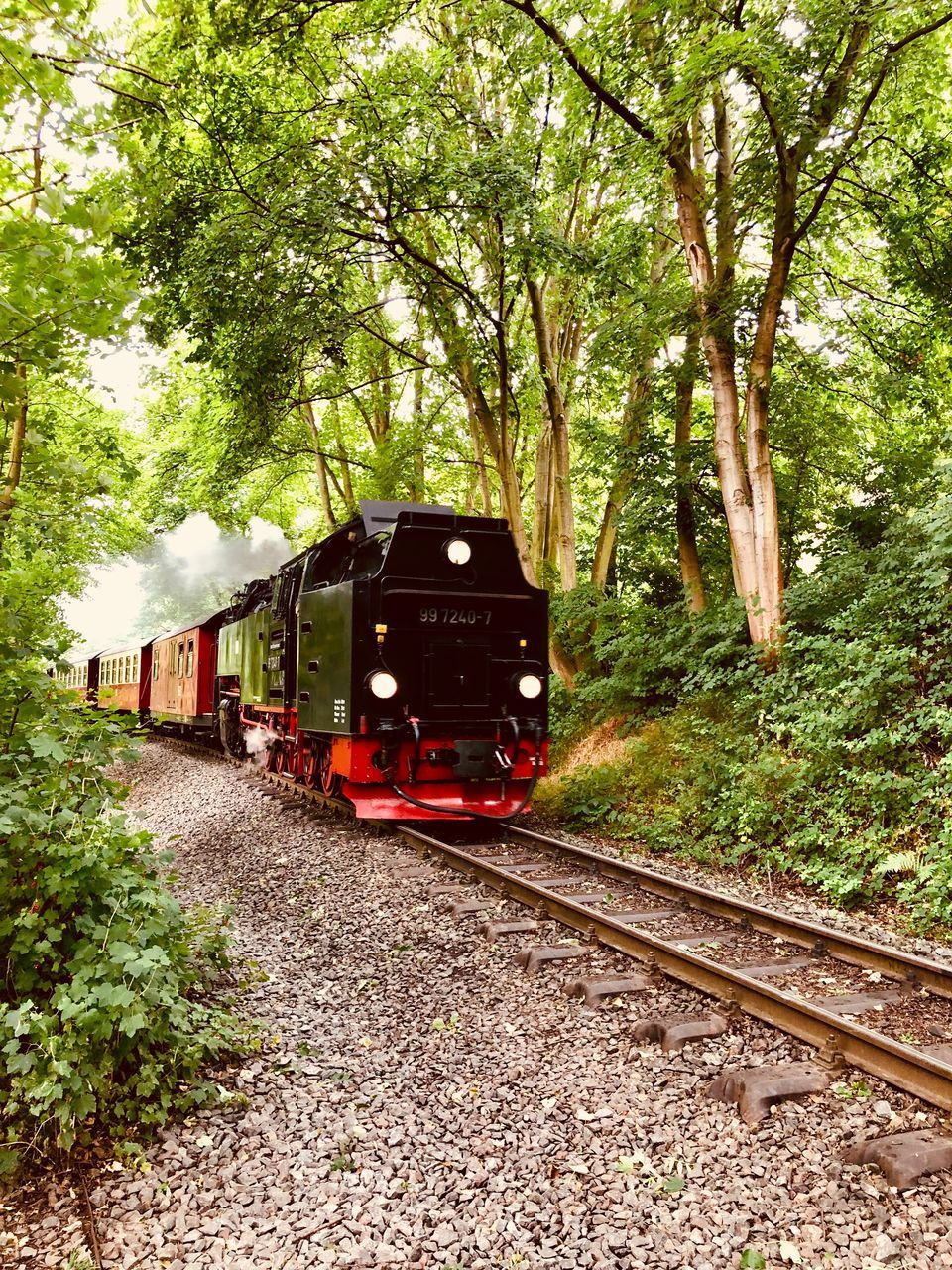 TRAIN ON RAILROAD TRACKS