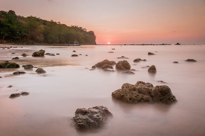 Scenic view of sea against sky during sunset