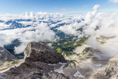 Aerial view of dramatic landscape over cloudy sky