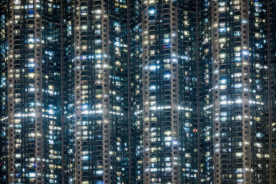 Full frame shot of modern buildings at night