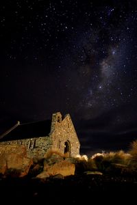 Low angle view of old building against sky at night