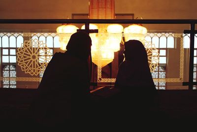 View of woman in dark room