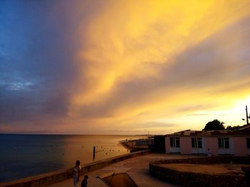 Scenic view of sea against cloudy sky