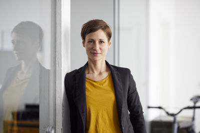 Businesswoman with bicycle in her start-up company