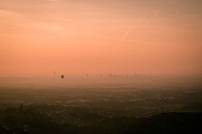 View of cityscape against sky during sunset