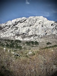 Scenic view of snowcapped mountains against sky