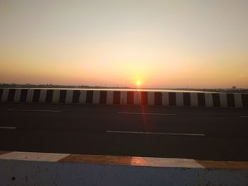 View of city against clear sky during sunset