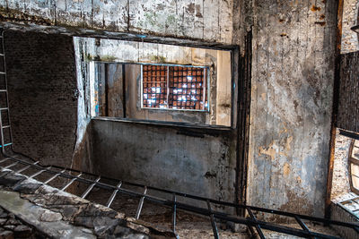 Damaged window of old building