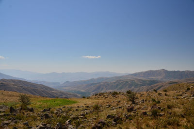 Scenic view of mountains against clear blue sky