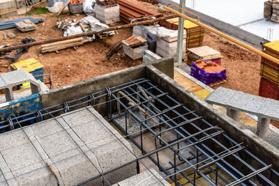 Construction site with steel formworks and reinforcing bars for pillars ready for concrete pouring