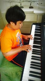 Boy playing piano