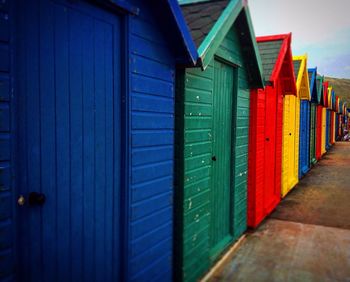 Colorful beach huts in row