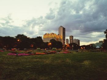 View of park and buildings against sky