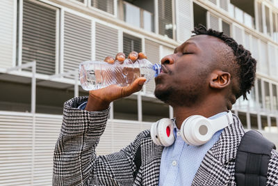 Midsection of man drinking food