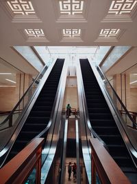 High angle view of people on escalator in building