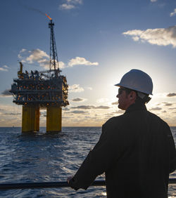 Offshore energy production with person on ship