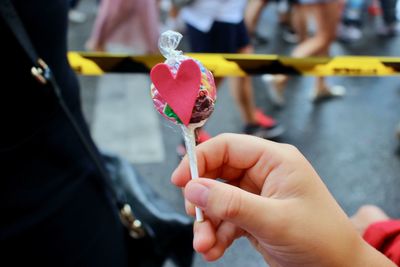 Close-up of hand holding ice cream