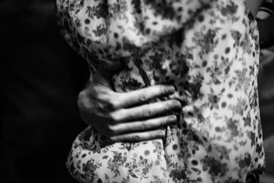 Close-up of woman touching hand